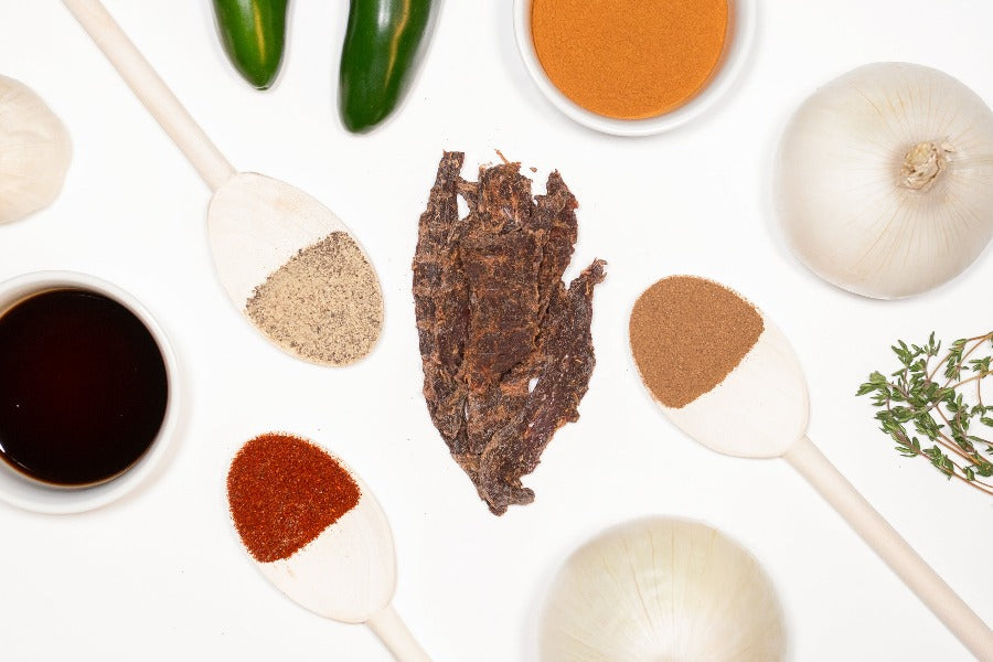 zesty jerk zero sugar beef jerky surrounded by ingredients