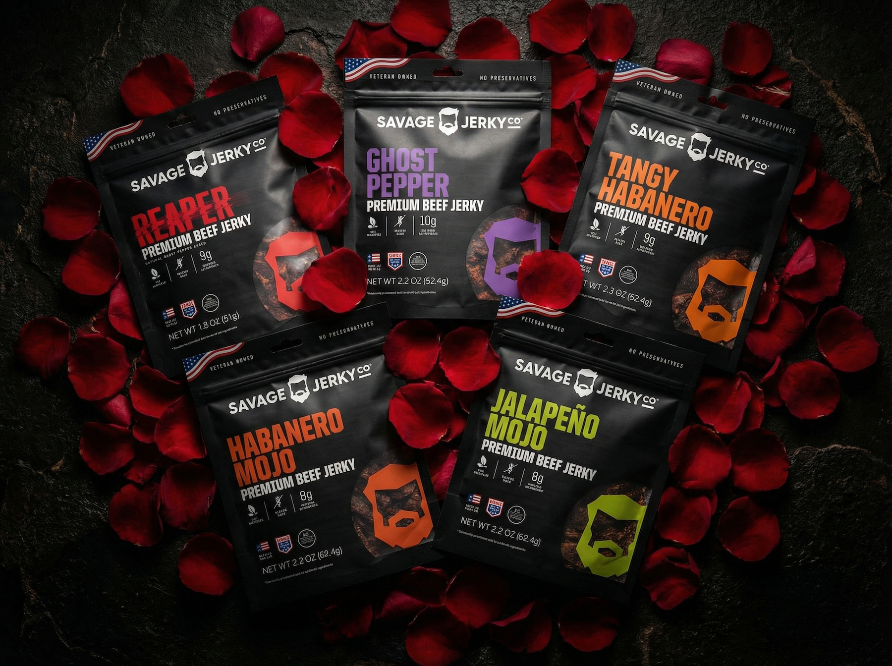 spicy savage jerky bags surrounded by rose petals