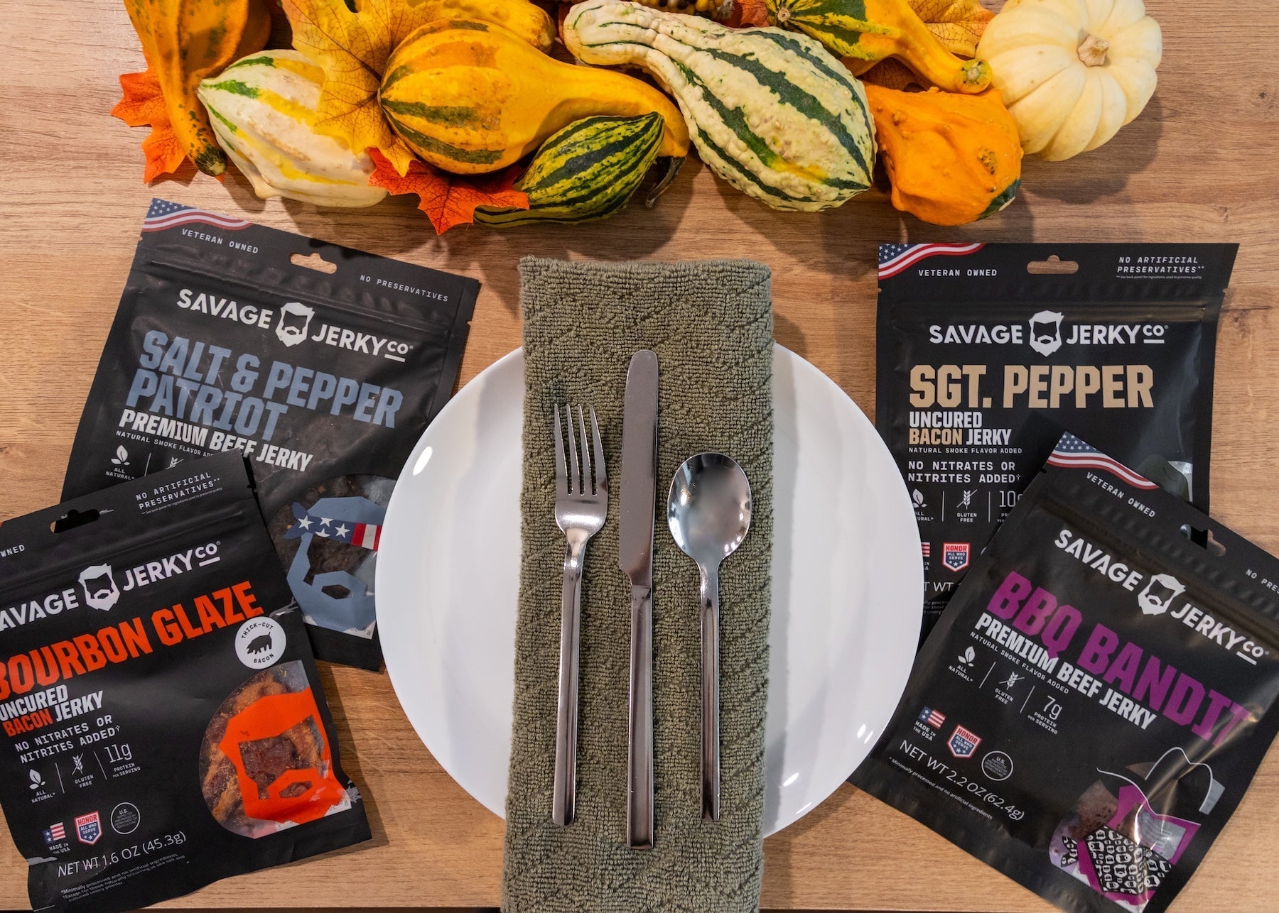 savage jerky bags surrounding thanksgiving dinner plate setting