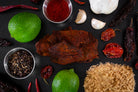 buff habanero premium beef jerky surrounded by ingredients on a dark slate background